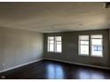 Spacious living room with dark hardwood floors and neutral walls at 5005 E 64Th St, Indianapolis, IN 46220