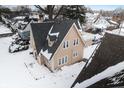 Aerial view of tan house and neighborhood at 714 Berkley Rd, Indianapolis, IN 46208