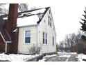 Yellow siding on the side of the house in winter at 906 Raible Ave, Anderson, IN 46011