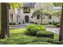Inviting front entrance with stone walkway and lush greenery at 11091 Crooked Stick Ln, Carmel, IN 46032