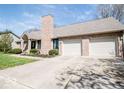 Traditional brick home with an attached two car garage and well manicured landscaping at 1966 Broadmoor Ln, Columbus, IN 47203
