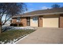 Brick ranch home with attached garage and landscaping at 1902 Alhambra Dr, Anderson, IN 46013