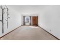 Bright living room featuring neutral walls and carpeting at 1902 Alhambra Dr, Anderson, IN 46013