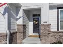 Inviting front entrance with brick columns and a charming wreath at 19046 Beverly Shones Ln, Noblesville, IN 46062
