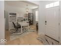 Home office with built-in shelving and a spacious desk area at 19046 Beverly Shones Ln, Noblesville, IN 46062