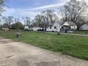 Expansive property featuring a home, garage, RV, and shed on a large, grassy lot at 2920 Newhart St, Indianapolis, IN 46217