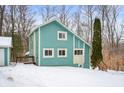 Teal house exterior with attached garage and deck, winter scene at 3764 Glenwood Dr, Martinsville, IN 46151