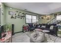 Spacious living room with gray floors and eclectic decor at 8023 Xenia Dr, Indianapolis, IN 46227
