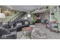 Open living space with a view into the kitchen and dining area at 8023 Xenia Dr, Indianapolis, IN 46227