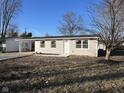 Newly renovated ranch home with gray siding, and a carport at 1054 Center St, Martinsville, IN 46151
