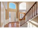 Two-story entry with hardwood floors and staircase at 11647 Antone Ct, Fishers, IN 46040