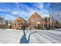 Brick two-story house, winter scene at 11647 Antone Ct, Fishers, IN 46040