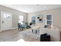 Living room features hardwood floors, comfy seating, and stylish decor at 1446 E Naomi St, Indianapolis, IN 46203