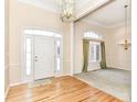 Light and airy entryway with hardwood floors and dining room view at 14580 Adios Pass, Carmel, IN 46032