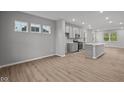 Bright, open-concept kitchen with an island, stainless steel appliances, and modern cabinets at 1721 Real St, Indianapolis, IN 46240