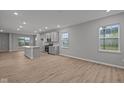Bright, open-concept kitchen with an island, stainless steel appliances, and modern cabinets at 1721 Real St, Indianapolis, IN 46240