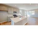 Modern kitchen featuring an island, stainless steel appliances, and sleek countertops at 1721 Real St, Indianapolis, IN 46240
