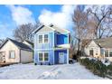 Two-story blue house with gray accents, white trim, and a light gray roof at 2136 Sugar Grove Ave, Indianapolis, IN 46202