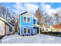 Two-story blue house with gray accents, white trim, and a light gray roof at 2136 Sugar Grove Ave, Indianapolis, IN 46202