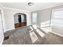 Bright living room with hardwood floors and archway at 244 W 38Th St, Anderson, IN 46013