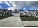 Two-story house with gray siding, white trim, and a two-car garage at 3406 Preakness St, Whitestown, IN 46075