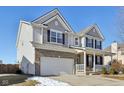 Two-story house with brick and siding exterior, attached garage, and front porch at 3460 Limelight Ln, Whitestown, IN 46075