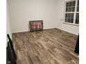 Spacious basement with wood-look tile flooring at 5154 Bramwell Ln, Whitestown, IN 46075