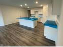Bright kitchen featuring a central island, modern white cabinets, and recessed lighting at 6636 Sulgrove Pl, Indianapolis, IN 46221