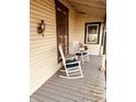Relaxing front porch with rocking chairs, offering a peaceful outdoor space at 704 S Ohio St, Sheridan, IN 46069