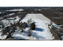Aerial view of house with large lot and surrounding fields at 868 N Raceway Rd, Indianapolis, IN 46234