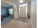 Bright entryway with tile flooring, leading to an office and living areas at 15365 Mystic Rock Dr, Carmel, IN 46033