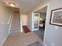View of entryway with staircase and access to office and other rooms at 15365 Mystic Rock Dr, Carmel, IN 46033
