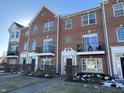 Brick front exterior of townhome with walkway and landscaping at 15365 Mystic Rock Dr, Carmel, IN 46033