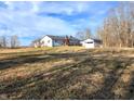 View of the large backyard with a detached garage and partial view of the back of the home at 1683 W State Road 42, Mooresville, IN 46158