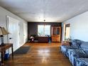 Bright entryway with hardwood floors and coat closet at 1683 W State Road 42, Mooresville, IN 46158
