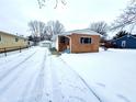 Brick ranch home with snow-covered yard and driveway at 176 Monroe St, Indianapolis, IN 46229