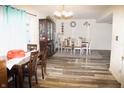 Bright dining room with hardwood floors and a charming table setting at 3721 Rinehall Dr, Indianapolis, IN 46235