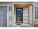 Front door entrance with a storm door and small porch at 3721 Rinehall Dr, Indianapolis, IN 46235