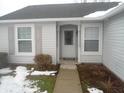 Ranch style home with gray siding, white door, and walkway at 4030 Fairoaks Ct, Franklin, IN 46131