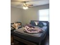 Bedroom with a bed, crib, and ceiling fan at 4715 E 33Rd St, Indianapolis, IN 46218