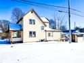 Two-story house with a snow covered backyard at 107 E Garfield St, Alexandria, IN 46001