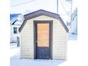 Small shed with a boarded-up door at 107 E Garfield St, Alexandria, IN 46001