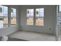 Bright breakfast nook surrounded by large windows at 13359 Vickery Ridge Dr, Fishers, IN 46037