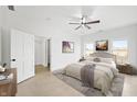 Serene bedroom with neutral tones, plush bedding, and ample natural light from the bright, large windows at 1600 S Morgantown Rd, Morgantown, IN 46160