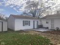 White detached garage with gray shutters and a deck at 2610 W 18Th St, Anderson, IN 46011