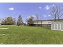 Large backyard with a shed and plenty of green space at 297 Van Buren St, Greenfield, IN 46140
