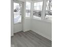 Bright sunroom with white walls and grey flooring at 3153 N Layman Ave, Indianapolis, IN 46218