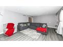 Living room with sectional sofa and red throw blanket at 3375 Lincoln Rd, Indianapolis, IN 46222