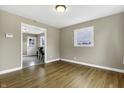 Bright dining room with hardwood floors and view into kitchen at 5201 N White Ln, Lawrence, IN 46226