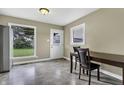 Eat-in kitchen with stainless steel appliances and wood cabinets at 5201 N White Ln, Lawrence, IN 46226